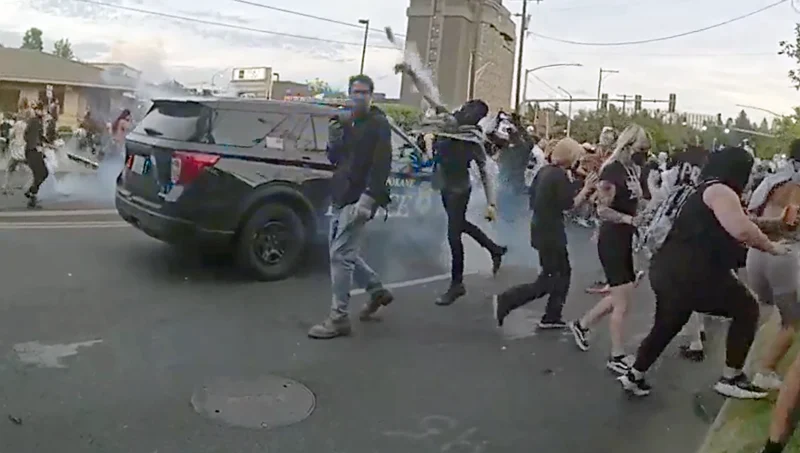 Former Spokane council president among dozens arrested during ICE protest
